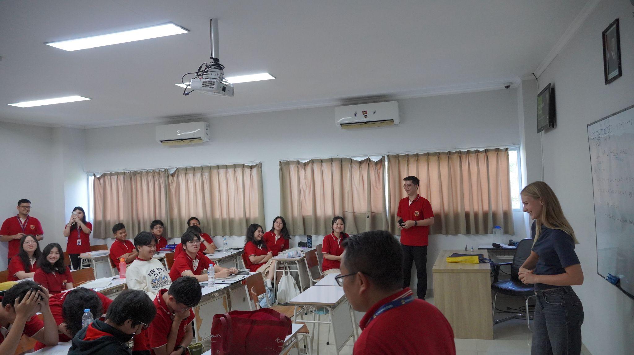 German exchange students speak with a class at Sekolah Karangturi.